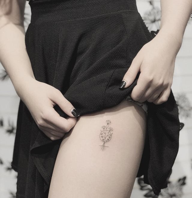 tattoo femenino para el muslo 57