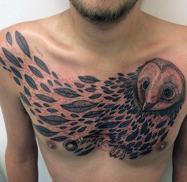 impresionante tatuaje buho hombre 49