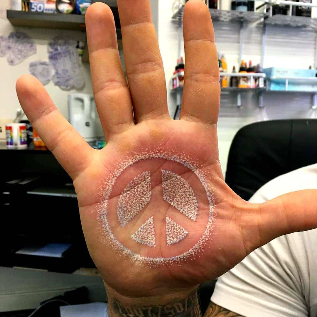 tattoo simbolo paz 70