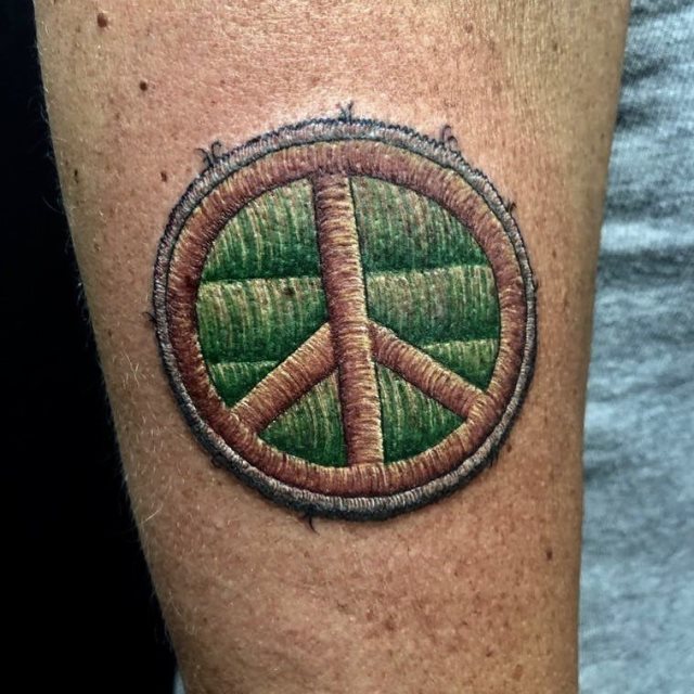 tattoo simbolo paz 74