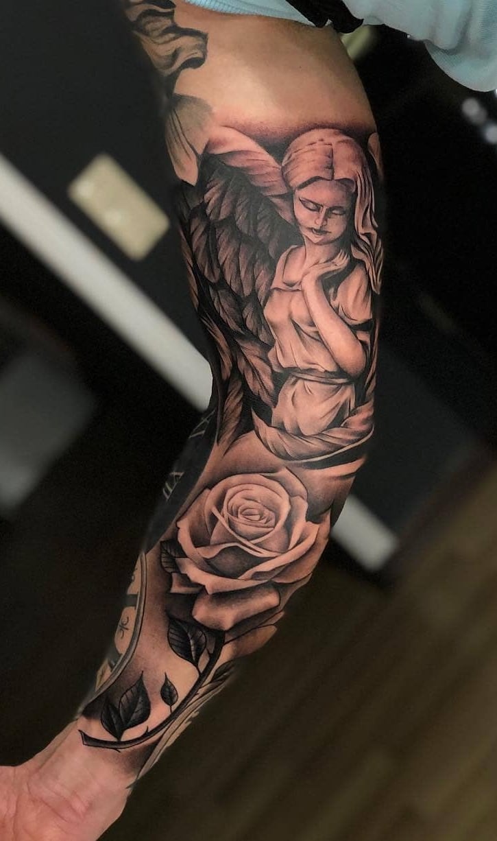 brazo lleno de tatuajes 30