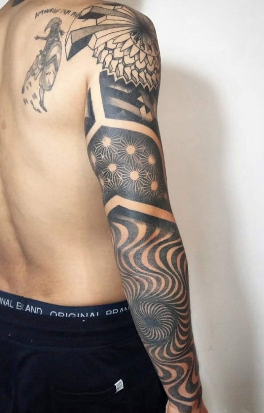 brazo lleno de tatuajes 46