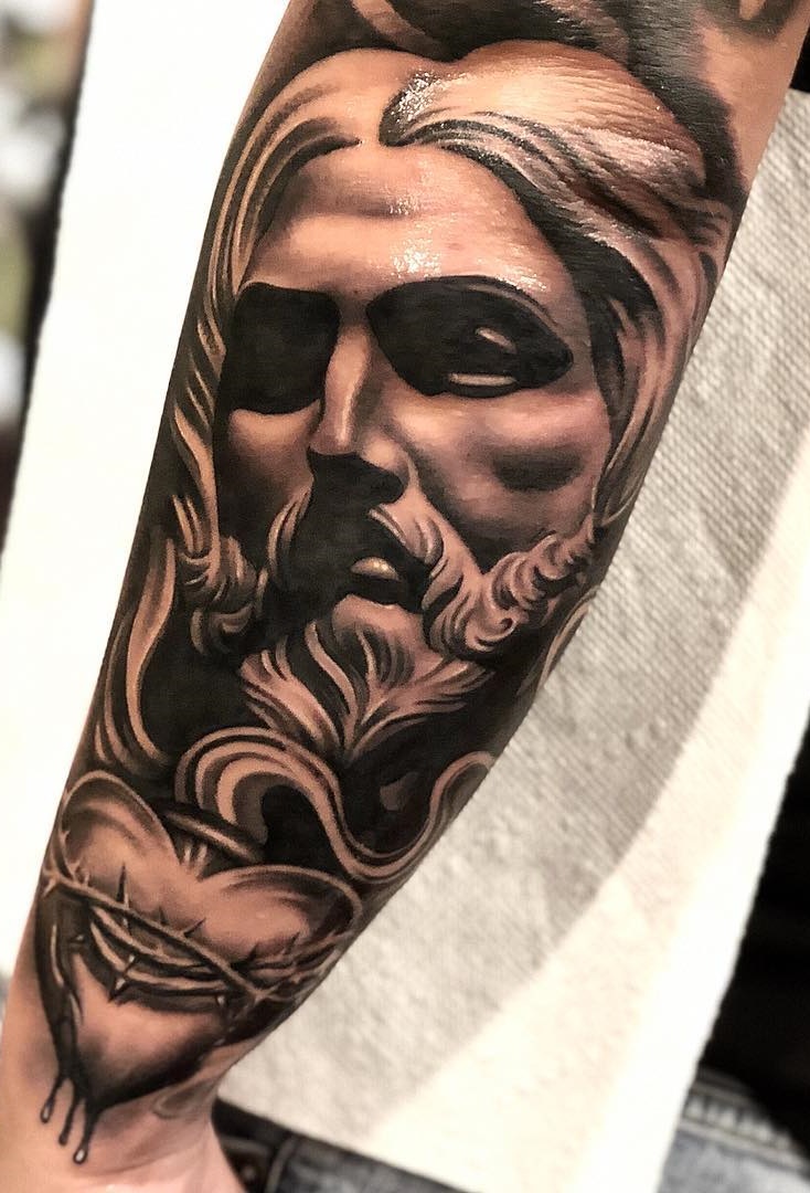 tattoo religioso para hombre 31