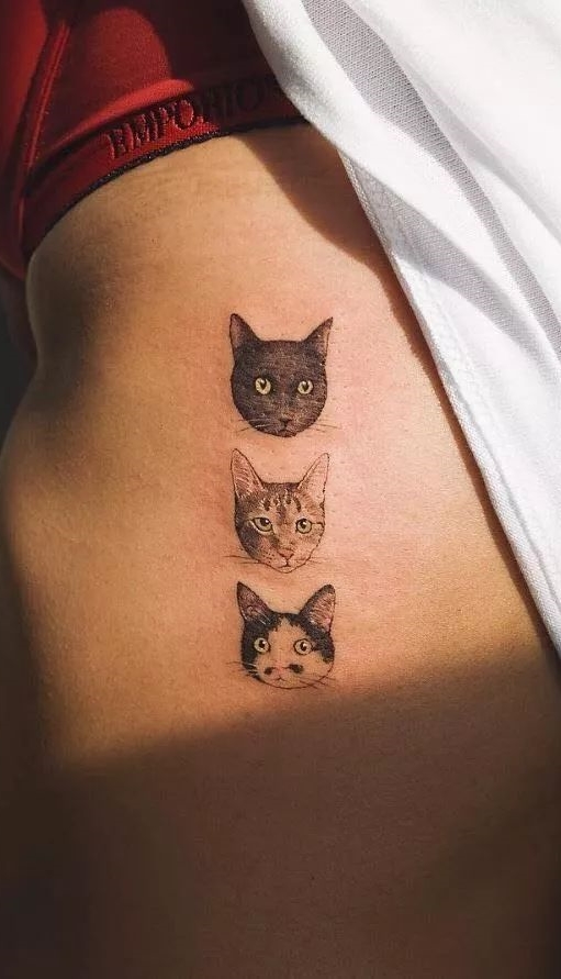 tatuaje gato en mujer 29