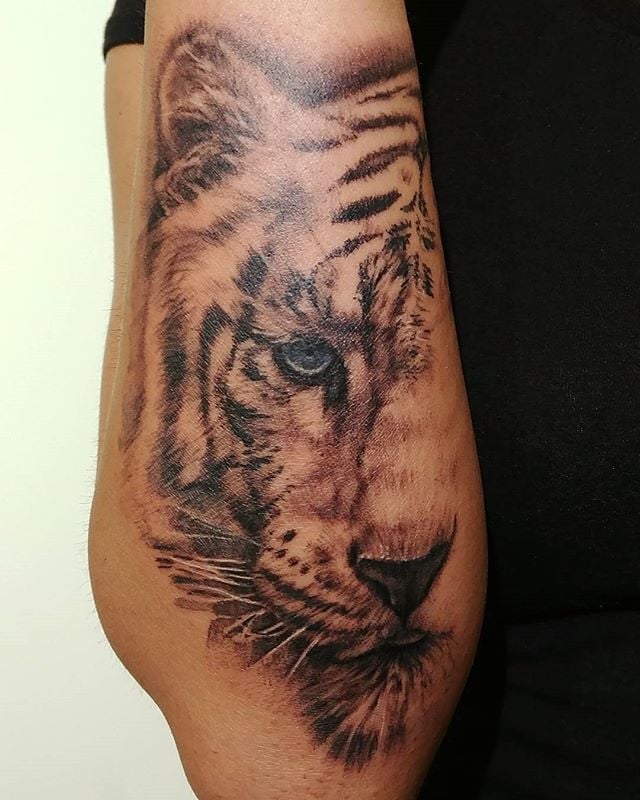 Que symbolise un tigre sur un tatouage ?