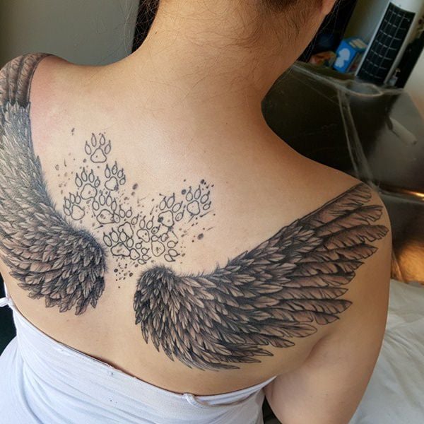 Que symbolisent des ailes d'ange sur un tatouage ?