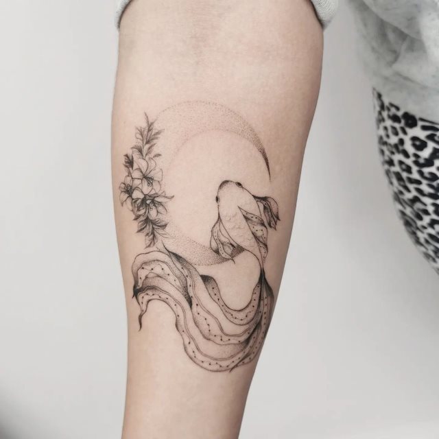 tattoo feminin poisson 42