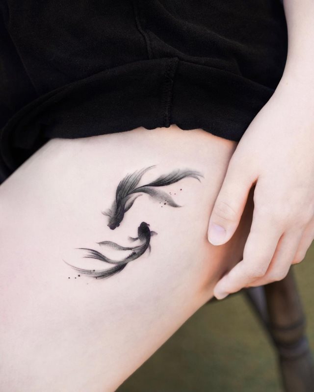 tattoo feminin poisson 63