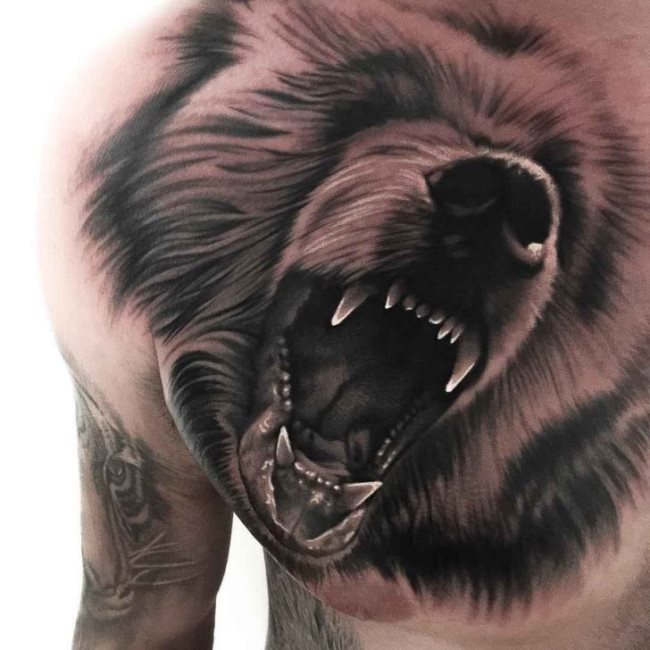 Que symbolise un tatouage d'animal ?