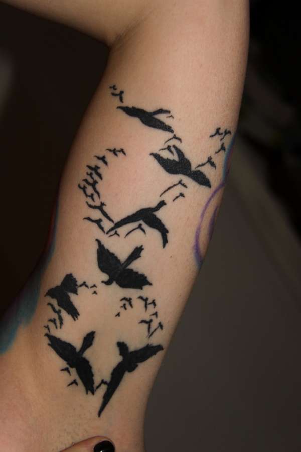 Que symbolise un oiseau sur un tatouage ?