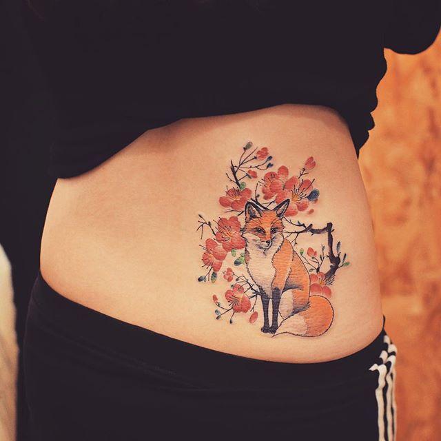 tatouage dos pour femme 189