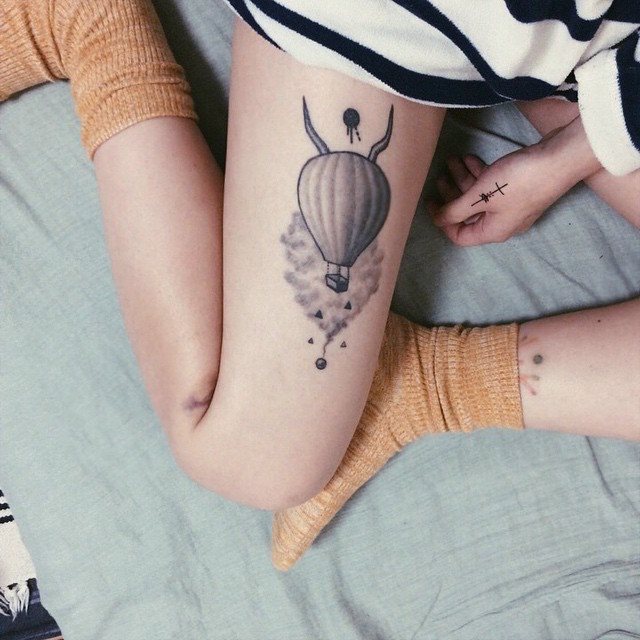 tatouage femme jambe 197