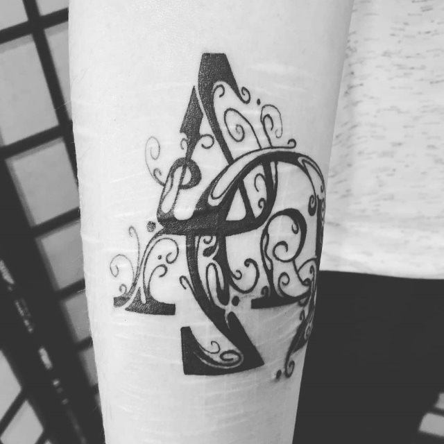 tatouage alpha et omega 09