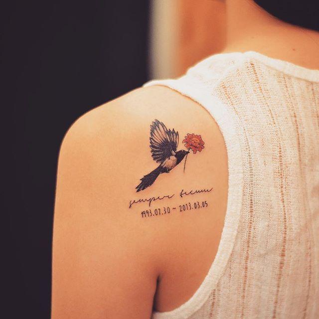 tatuaggio dietro per donna 161