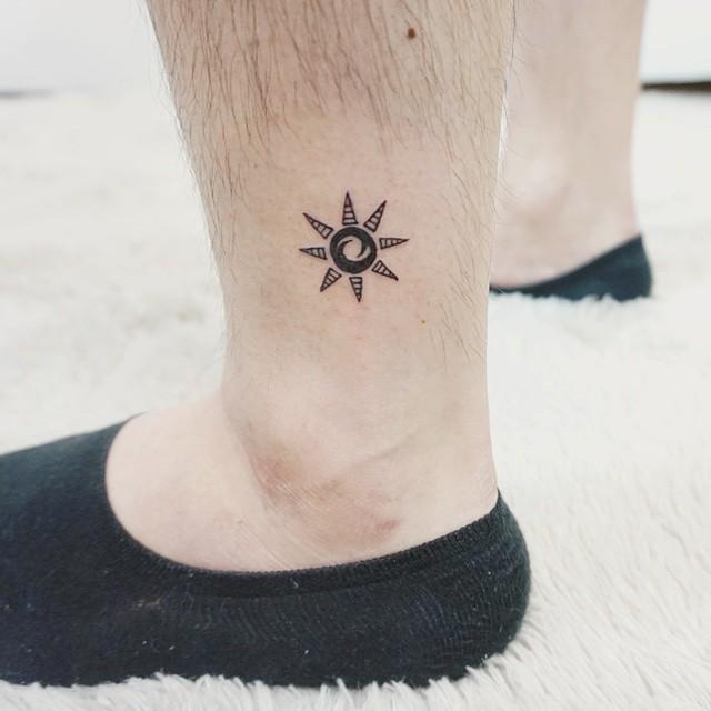 tatuaggio sole 77